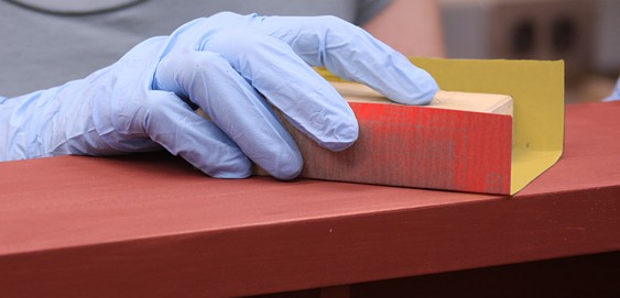 Hand sanding with cabinet paper